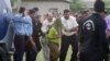 Pakistani police officials escort a young Christian girl accused of blasphemy for allegedly burning pages of a Quran, toward a helicopter following her release from central prison on the outskirts of Rawalpindi, September 8, 2012.
