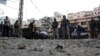 Residents and Lebanese army soldiers inspect damage following days of clashes between Sunni Muslims and Alawites in the port-city of Tripoli, northern Lebanon, December 10, 2012. 