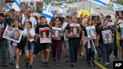 Families and friends of about 240 hostages held by Hamas in Gaza call for their return as they participate in a five-day "March for the Hostages" from Tel Aviv to the Prime Minister's Office in Jerusalem, near the town of Abu Ghosh, Israel, Nov. 17, 2023.