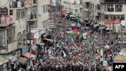 FILE - Members of Jordan's Darak forces (gendarmerie) stand on guard as protesters gather for a rally in solidarity with Palestinians in the Gaza Strip in Amman on Oct. 27, 2023. 
