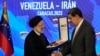 Iranian President Ebrahim Raisi shakes hands with Venezuelan President Nicolas Maduro, at Miraflores presidential palace in Caracas, Venezuela, June 12, 2023. 