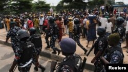 FILE - Nigerian police patrol as anti-government demonstrations against bad governance and economic hardship continue, in Lagos, Nigeria, Aug. 5, 2024.