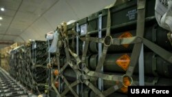 FILE - Pallets of ammunition, bound for Ukraine, are secured inside a commercial aircraft during a security assistance mission at Dover Air Force Base, Delaware, Jan. 13, 2023. 