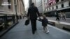 FILE -- A recent survey finds that 77% of respondents prioritize a balanced life over advancement at work.