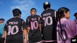 Lionel Messi fans wait to enter the stadium before a soccer match between Inter Miami and Cruz Azul, July 21, 2023, in Fort Lauderdale, Fla.