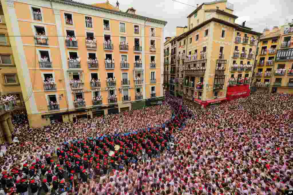 A music band plays in the town hall square after the 'Chupinazo' rocket, to mark the official opening of the 2023 San Fermín fiestas in Pamplona, Spain, July 6, 2023.