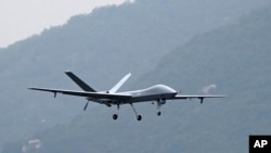 FILE - An Attack-2 drone flies during a training in Zhuhai in southern China's Guangdong province on Nov. 5, 2022, in this photo released by Xinhua News Agency. 
