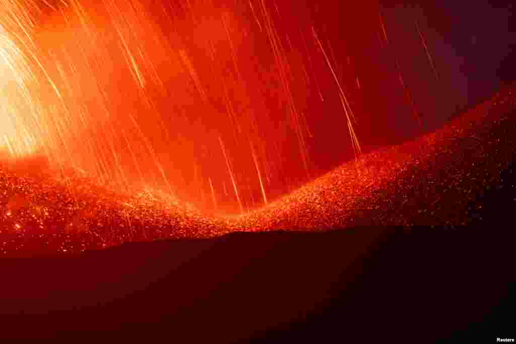 Lava sprews from a crater of Mount Etna, Europe's most active volcano, Italy, July 7, 2024.