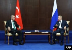 FILE - Turkish President Recep Tayyip Erdogan, left, meets Russian President Vladimir Putin, in Astana, Oct. 13, 2022. (Turkish Presidential Press Service/Handout to AFP)