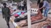 Jenazah para korban tewas tampak dibaringkan di pinggir jalan pasca badai dan banjir dahsyat di kota pesisir Derna, Libya (13/9). 