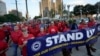 UAW Leaders Push Ahead With Ford Contract as GM Talks Drag