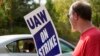 Striking United Auto Workers member David Martin holds a sign outside the General Motors Customer Care and After-Sales facility in Brandon, Miss., Sept. 22, 2023. Unionized workers joined others in new nationwide walkouts as the labor standoff continued.