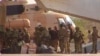 FILE - This undated photograph provided by the French military shows Russian mercenaries boarding a helicopter in northern Mali. (French Army via AP)