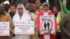 Protesters carry placards lauding marriages between a man and a woman, in Blantyre, Malawi, July 13, 2023. (Lameck Masina/VOA)