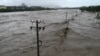 Extreme Rain in Beijing After Typhoon Turns Roads Into Rivers, Kills Two 