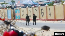 FILE - Somali military soldiers patrol outside the Aden Adde International Airport in Mogadishu, Somalia, April 27, 2022. The airport was named as a possible target after threats to multiple locations in the capital were received by the U.S. Embassy in Nairobi in April 2024. 