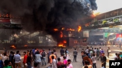FILE - Anti-quota protesters clash with the police in Dhaka on July 18, 2024.