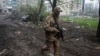 A Ukrainian soldier walks in in Bakhmut, Donetsk region, Ukraine, April 21, 2023. 