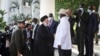 Iran's President Ebrahim Raisi, center-left, shakes hands with Uganda's President Yoweri Museveni, center-right, at the State House in Entebbe, Uganda July 12, 2023.