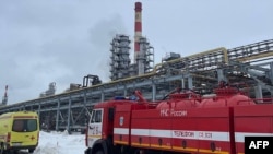This handout photograph shows emergency vehicles at the spot of a fire on the grounds of a fuel and energy complex in the town of Kstovo, March 12, 2024. (Photo by Handout / TELEGRAM / @glebnikitin_nn / AFP) 