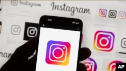 FILE - The Instagram logo is seen on a cellphone in Boston, Oct. 14, 2022.