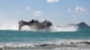 A Japan Maritime Self Defense Force landing craft air cushion prepares to land on Bellows Beach during a joint exercise between Japan and the Peruvian navy at the Rim of the Pacific (RIMPAC) military exercises in Waimanalo, Hawaii, July 18, 2024.