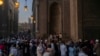Thousands of worshippers gather around Old Cairo’s Mosque of Sultan Hassan for the end of the fasting month of Ramadan and the start of Eid al-Fitr, which is determined by official sightings of the new moon and one’s geographic location. 