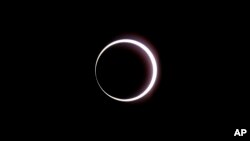 The moon passes between the Earth and the sun during a rare "ring of fire" eclipse of the sun, Oct. 14, 2023, in Bryce Canyon National Park, Utah.