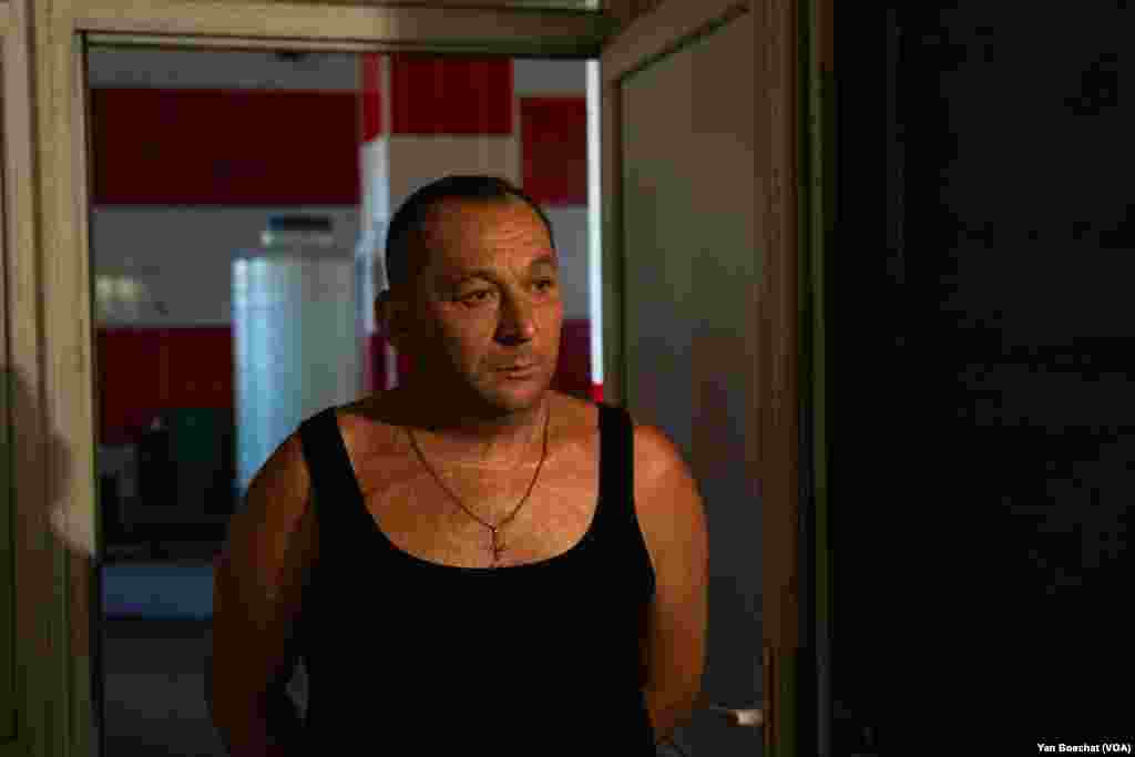 Andriy, a former firefighter, helps run the shelter in the former fire station for people in Velyka Novosilka, Ukraine, on Aug. 23, 2023