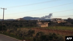 A handout image released March 12, 2023, by the official Syrian Arab News Agency (SANA) shows smoke billowing from a site Damascus says was targeted by Israeli airstrikes, in Masyaf, in Syria's central Hama countryside.