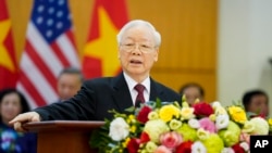 FILE - Vietnamese General Secretary Nguyen Phu Trong and U.S. President Joe Biden, unseen, deliver remarks at the Communist Party of Vietnam Headquarters, in Hanoi, Sept. 10, 2023.