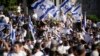 With some of them chanting “Death to Arabs”, Israelis wave national flags during a march marking Jerusalem Day, an Israeli holiday celebrating the capture of east Jerusalem in the 1967 Mideast war, in front of the Damascus Gate of Jerusalem's Old City, June 5, 2024.