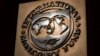 FILE - The logo of the International Monetary Fund is visible on its building in Washington, April 5, 2021. 