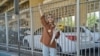 Iran Re-Arrests Reporter Who Interviewed Amini Father, Activists Say