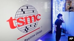 FILE - The logo of TSMC (Taiwan Semiconductor Manufacturing Company) is shown during the Taiwan Innotech Expo at the World Trade Center in Taipei, Taiwan, Oct. 14, 2022.
