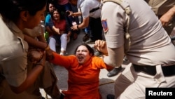 Police detain supporters of the Aam Aadmi Party during a protest after the party's main leader and Delhi Chief Minister Arvind Kejriwal was arrested by the Enforcement Directorate, India's financial crime agency, in New Delhi, March 26, 2024.