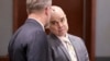 Robert Telles, right, a former Clark County public administrator charged in the murder of journalist Jeff German, talks with attorney Robert Draskovich during a break in his trial at the Regional Justice Center in Las Vegas, Aug. 16, 2024.