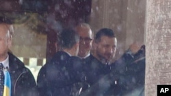Ukrainian President Zelenskyy, right, leaves his hotel for a meeting with Italian President Sergio Mattarella, May 13, 2023. Zelenskyy to later meet with the pope at The Vatican.