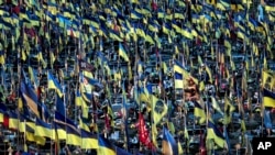 Ukrainian flags flutter over hundreds graves of Ukrainian servicemen killed in fighting since Russian invasion, in Kharkiv, Ukraine, June 6, 2024.