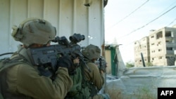 This handout picture released by the Israeli army on April 22, 2024, shows Israeli soldiers operating in the Gaza Strip.