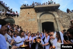 FILE - Iraqi Yazidis visit the Lalish Temple, on the day of a ceremony for the occasion of Red Wednesday, the celebration of the Yazidi New Year, in Shekhan district, in Duhok province, Iraq, April 18, 2023. (REUTERS/Ari Jalal)