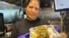 Concepción García Linares, original de Michoacán, con un par de tacos elaborados en la taquería Pilo's de Miami, Florida.