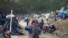 Migrantes de Venezuela se preparan para ser reubicados en un refugioen Matamoros, México, el 23 de diciembre de 2022.