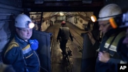 Miners head down for work at the pit-face at a coal mine in Dnipropetrovsk region, Ukraine, April 7, 2023.