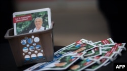 FILE - Election pamphlets of Far-right Alternative for Germany (AfD) candidate Joerg Prophet during a campaign for mayoral elections in Nordhausen, central Germany, Sept. 21, 2023. 