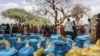 Personnel form the United Nations Children's Fund (UNICEF) and from the NGO Premiere Urgence prepare aid kits for Sudanese refugees who crossed into Chad, in Koufroun, near Echbara, on April 30, 2023.