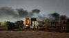 FILE - Smoke billows in southern Khartoum on May 29, 2023, amid ongoing fighting in Sudan. The United Nations is hosting talks in Geneva on July 11, 2024, involving the warring sides about how to protect civilians and ensure delivery of humanitarian aid. 