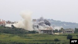 Smoke billows from the site of an Israeli airstrike on the southern Lebanese village of Tayr Harfa near the border on April 26, 2024.