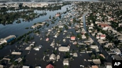 Streets are flooded in Kherson, Ukraine, Wednesday, June 7, 2023 after the walls of the Kakhovka dam collapsed.