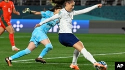 United States' Alex Morgan takes a shot on goal during the Women's World Cup Group E soccer match between Portugal and the United States at Eden Park in Auckland, New Zealand, Aug. 1, 2023.